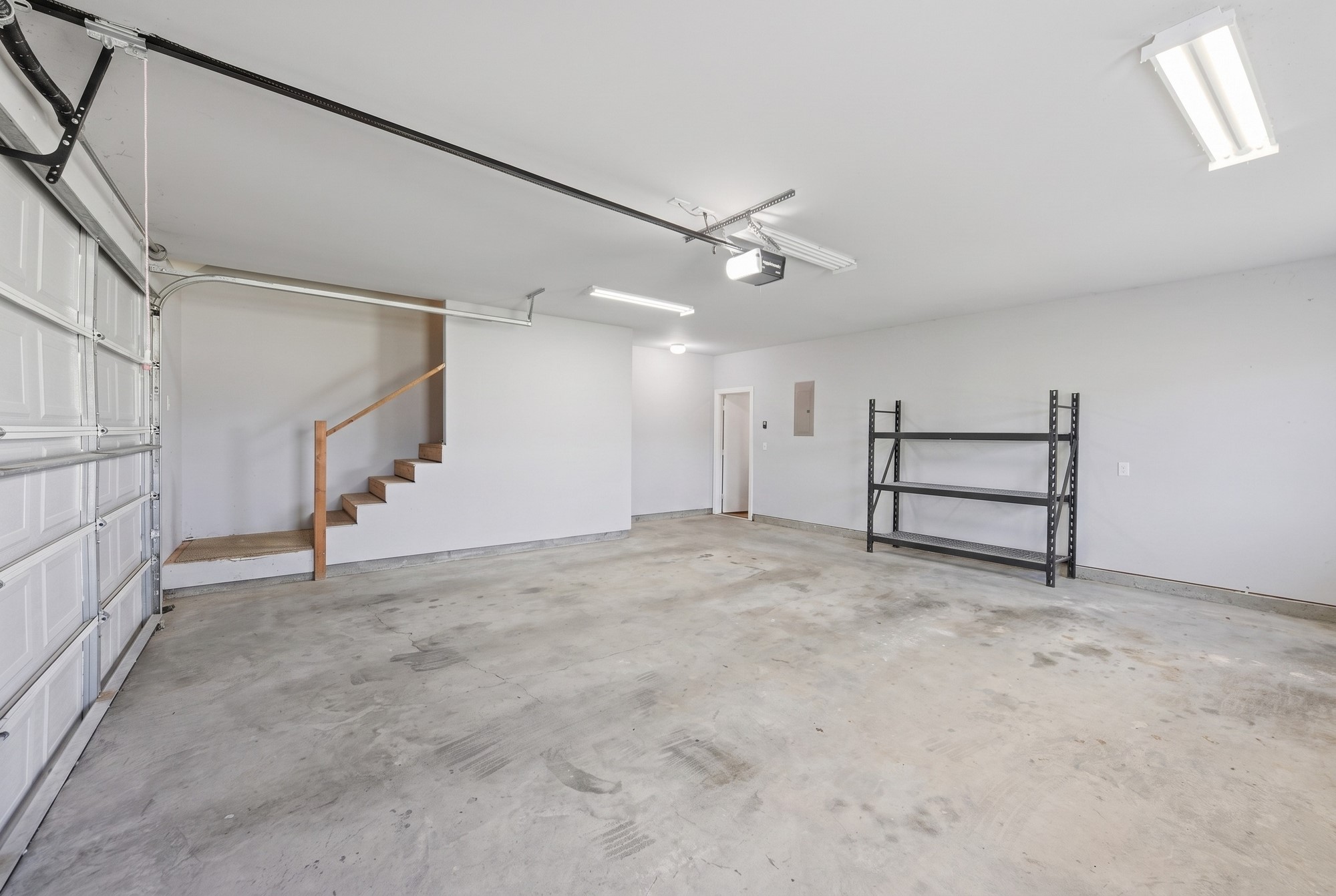 1205 Pecan Glen Road Brenham, TX 77833 - Photo 37 of 40 Oversized Garage with stairs to the Gameroom