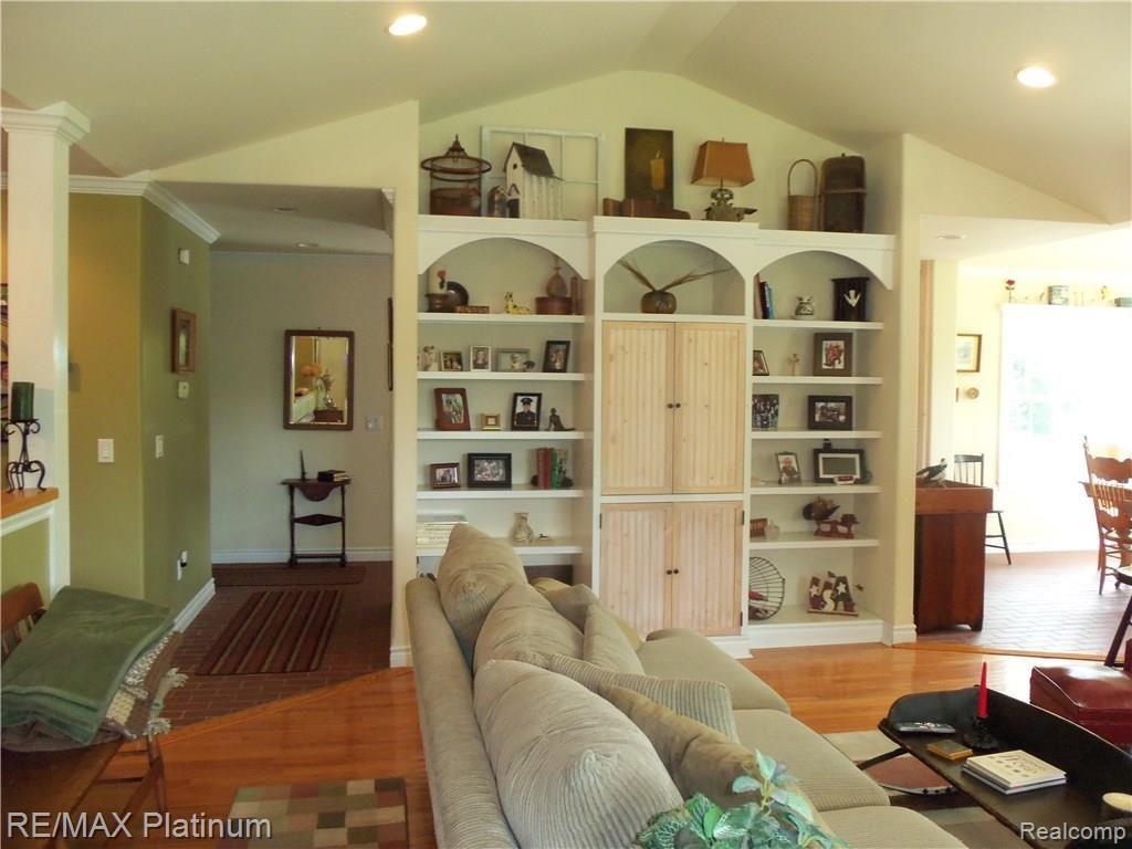 9906 Bergin Road Howell, MI 48843 - Photo 4 of 31 ENTERTAINMENT CENTER IN LIVING ROOM