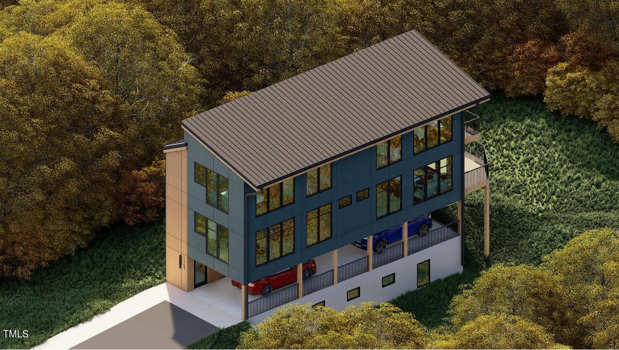 1709 Evergreen Avenue Raleigh, NC 27603 - Photo 1 of 6 a front view of a house with balcony and trees