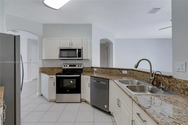 $695,000 | 8450 Northwest 113th Place, Doral, FL 33178