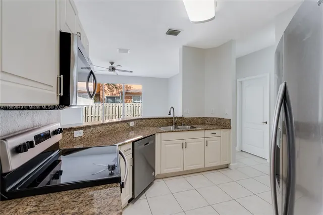 $695,000 | 8450 Northwest 113th Place, Doral, FL 33178