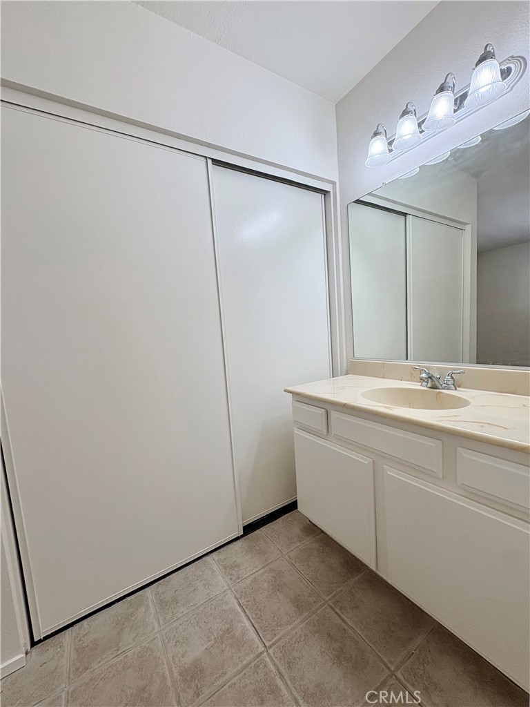 18223 Soledad Canyon Road, Unit 29 Canyon Country, CA 91387 - Photo 15 of 23 a bathroom with a double vanity sink and a mirror