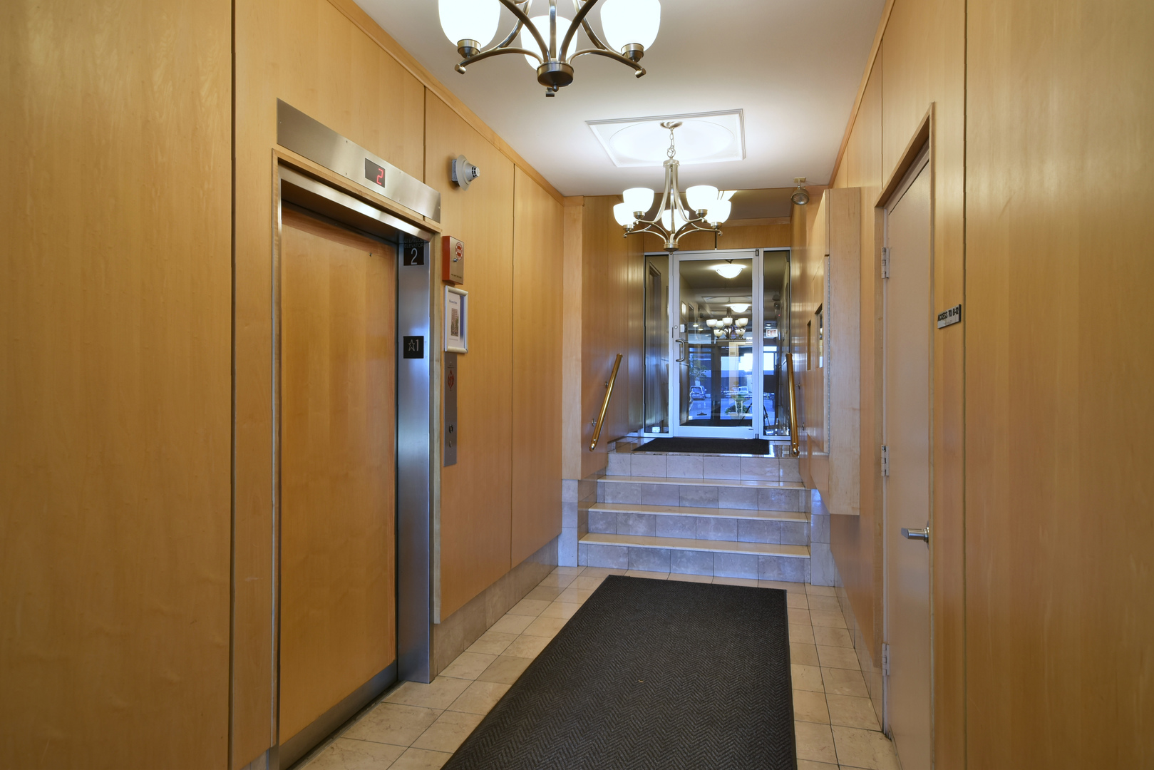 6118 North Sheridan Road, Unit 406 Chicago, IL 60660 - Photo 4 of 26 a view of a hallway with livingroom and wooden floor