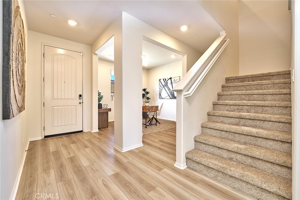 32846 Forgecroft Street Menifee, CA 92584 - Photo 18 of 48 a view of entryway with wooden floor and stairs