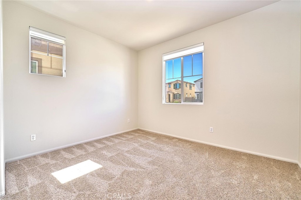 32846 Forgecroft Street Menifee, CA 92584 - Photo 32 of 48 a view of an empty room with a window
