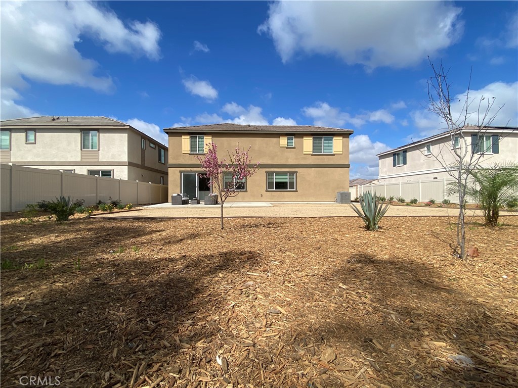 32846 Forgecroft Street Menifee, CA 92584 - Photo 38 of 48 a front view of a house with a yard