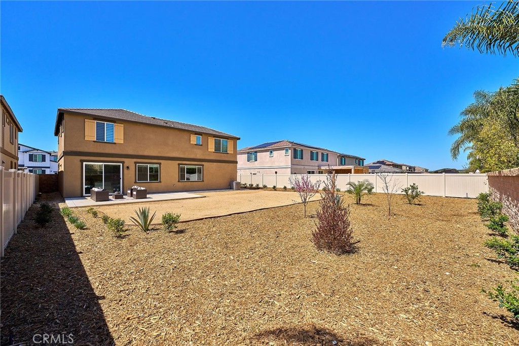 32846 Forgecroft Street Menifee, CA 92584 - Photo 41 of 48 a swimming pool with buildings in the background