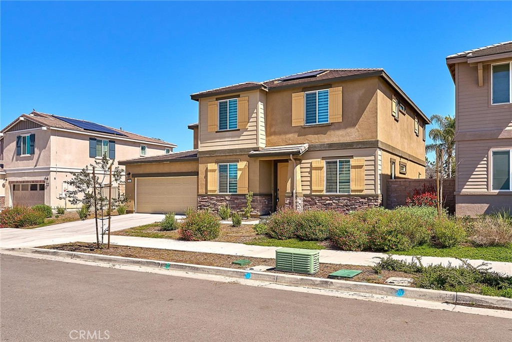 32846 Forgecroft Street Menifee, CA 92584 - Photo 44 of 48 a front view of a house with a yard