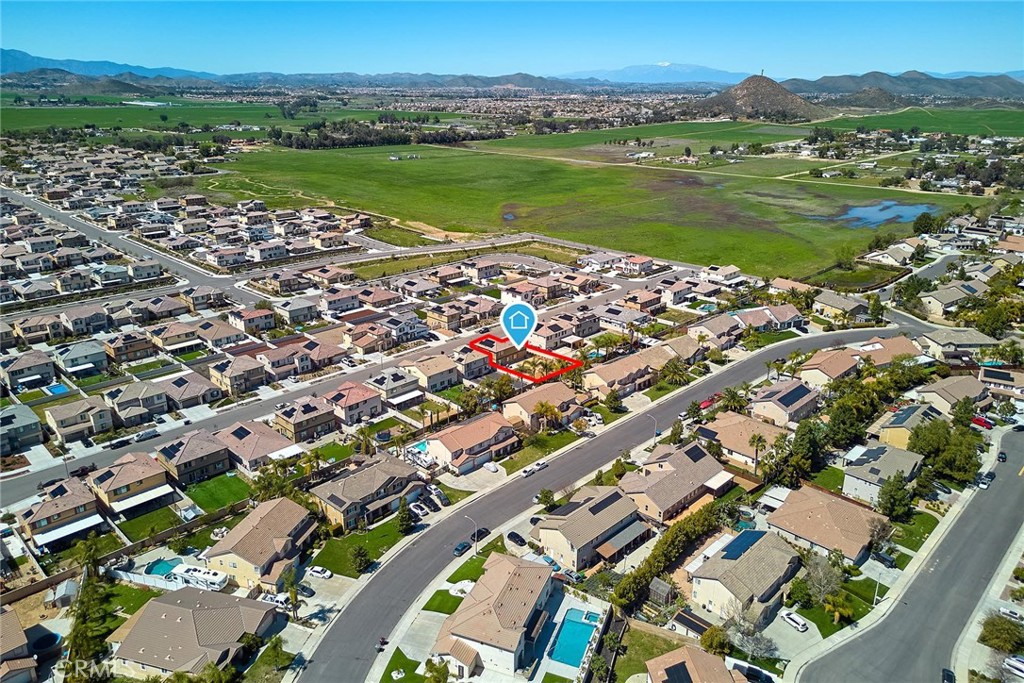 32846 Forgecroft Street Menifee, CA 92584 - Photo 48 of 48 an aerial view of a city with lots of residential buildings