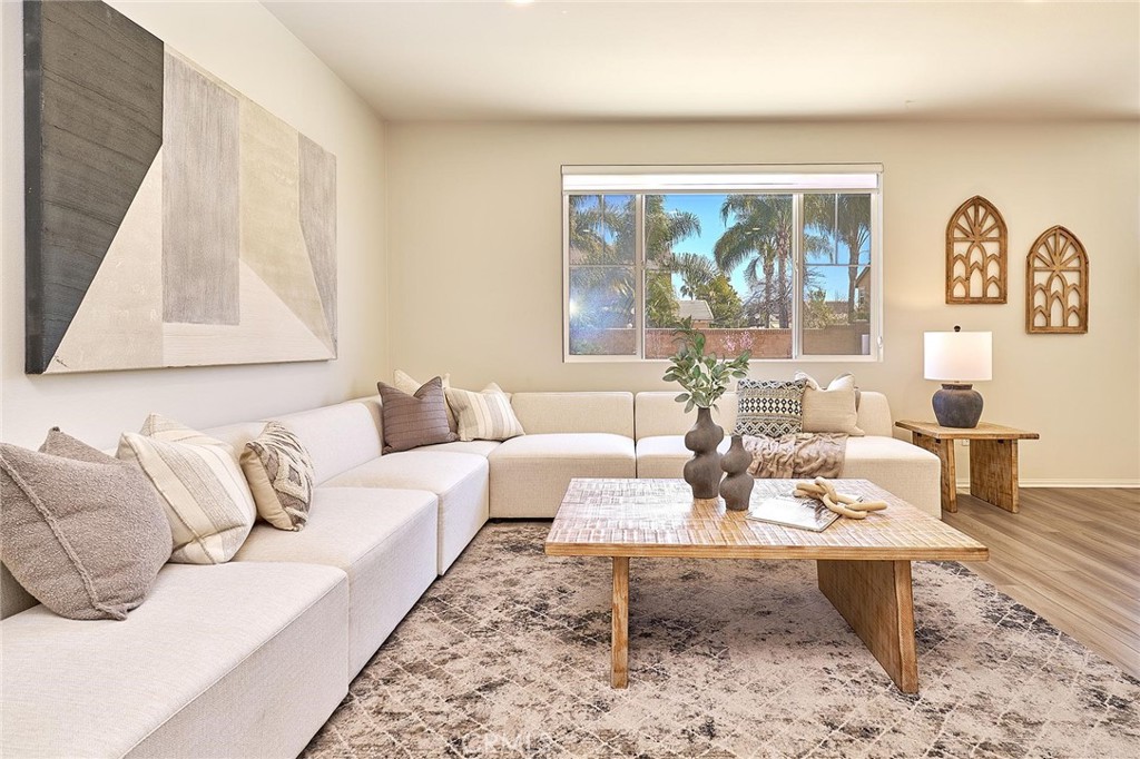 32846 Forgecroft Street Menifee, CA 92584 - Photo 8 of 48 a living room with furniture and a large window