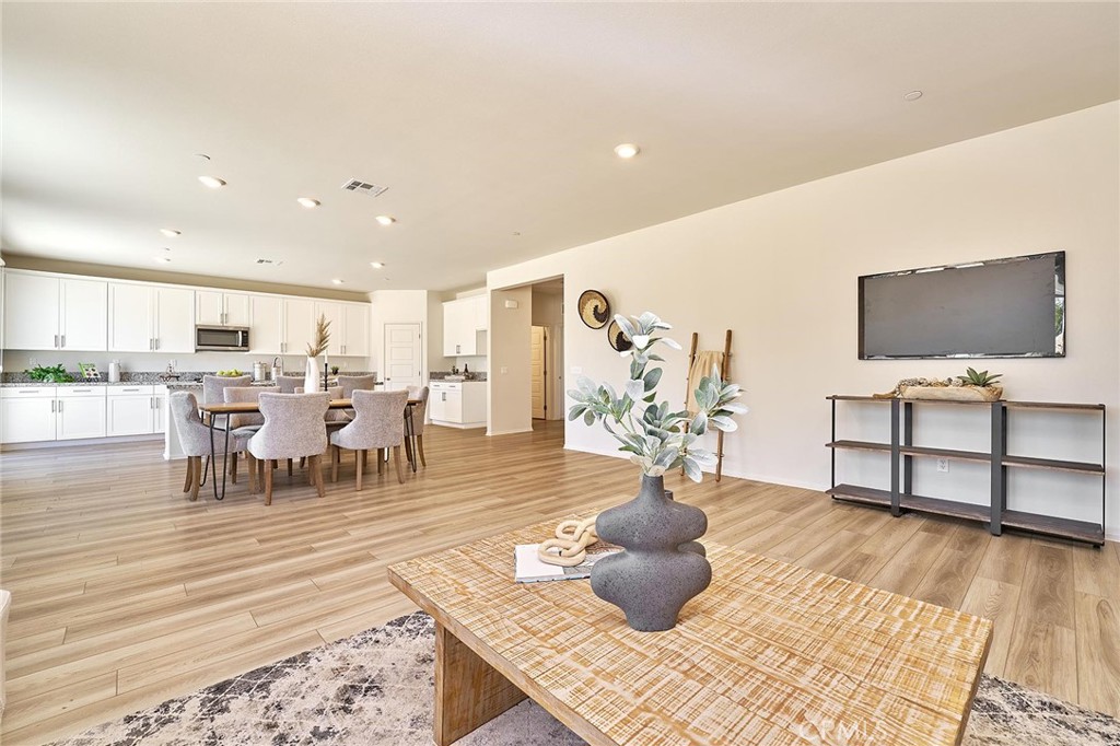 32846 Forgecroft Street Menifee, CA 92584 - Photo 10 of 48 a living room with furniture and a flat screen tv