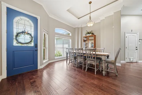 a kitchen with a stove sink and cabinets
