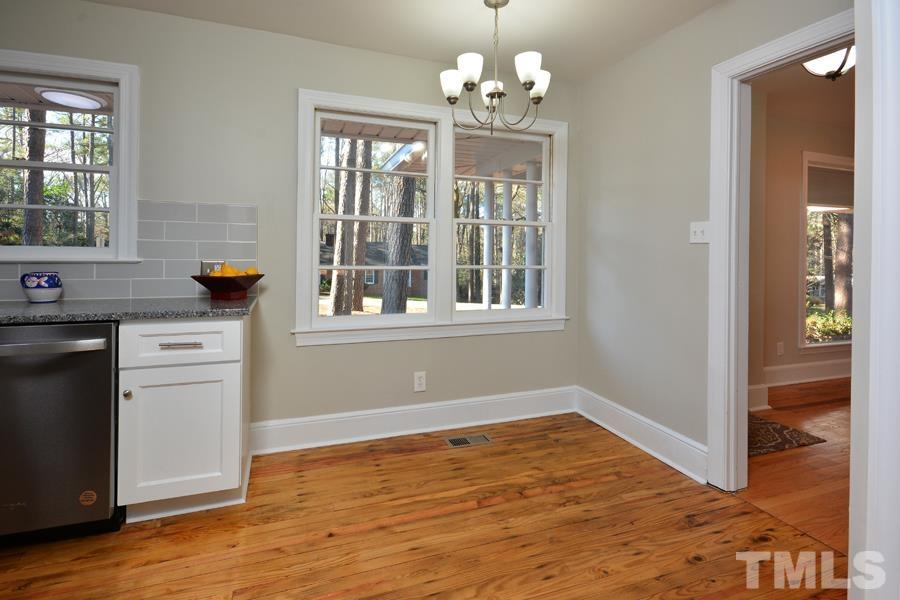 402 Monticello Avenue Durham, NC 27707 - Photo 11 of 24 a view of empty room with wooden floor and fan