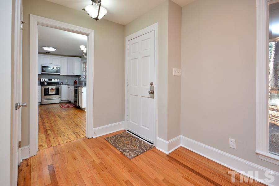 402 Monticello Avenue Durham, NC 27707 - Photo 22 of 24 a bedroom with a bed and a window