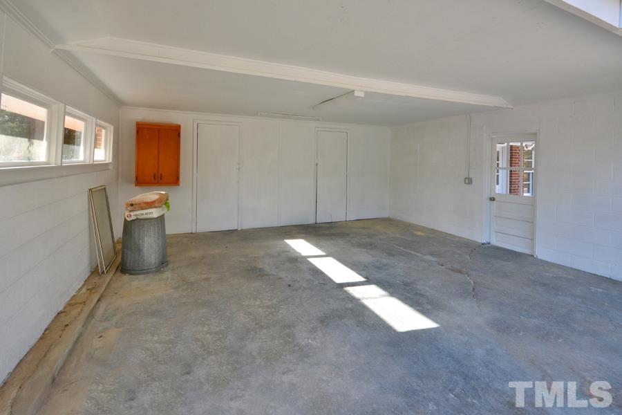 402 Monticello Avenue Durham, NC 27707 - Photo 6 of 24 an empty room with windows