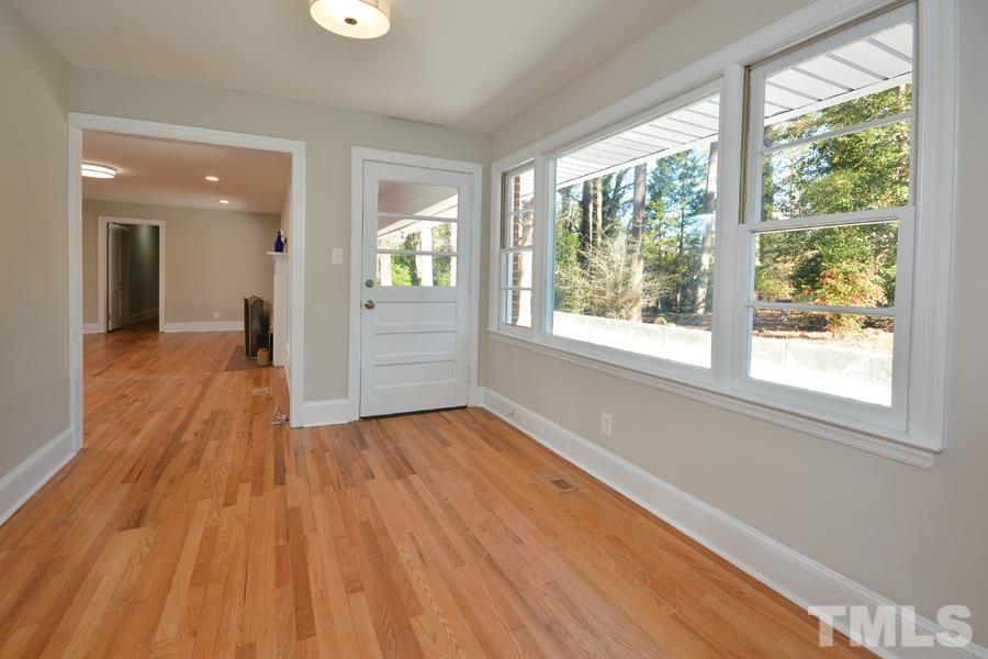 402 Monticello Avenue Durham, NC 27707 - Photo 7 of 24 a view of a room with wooden floor and a window