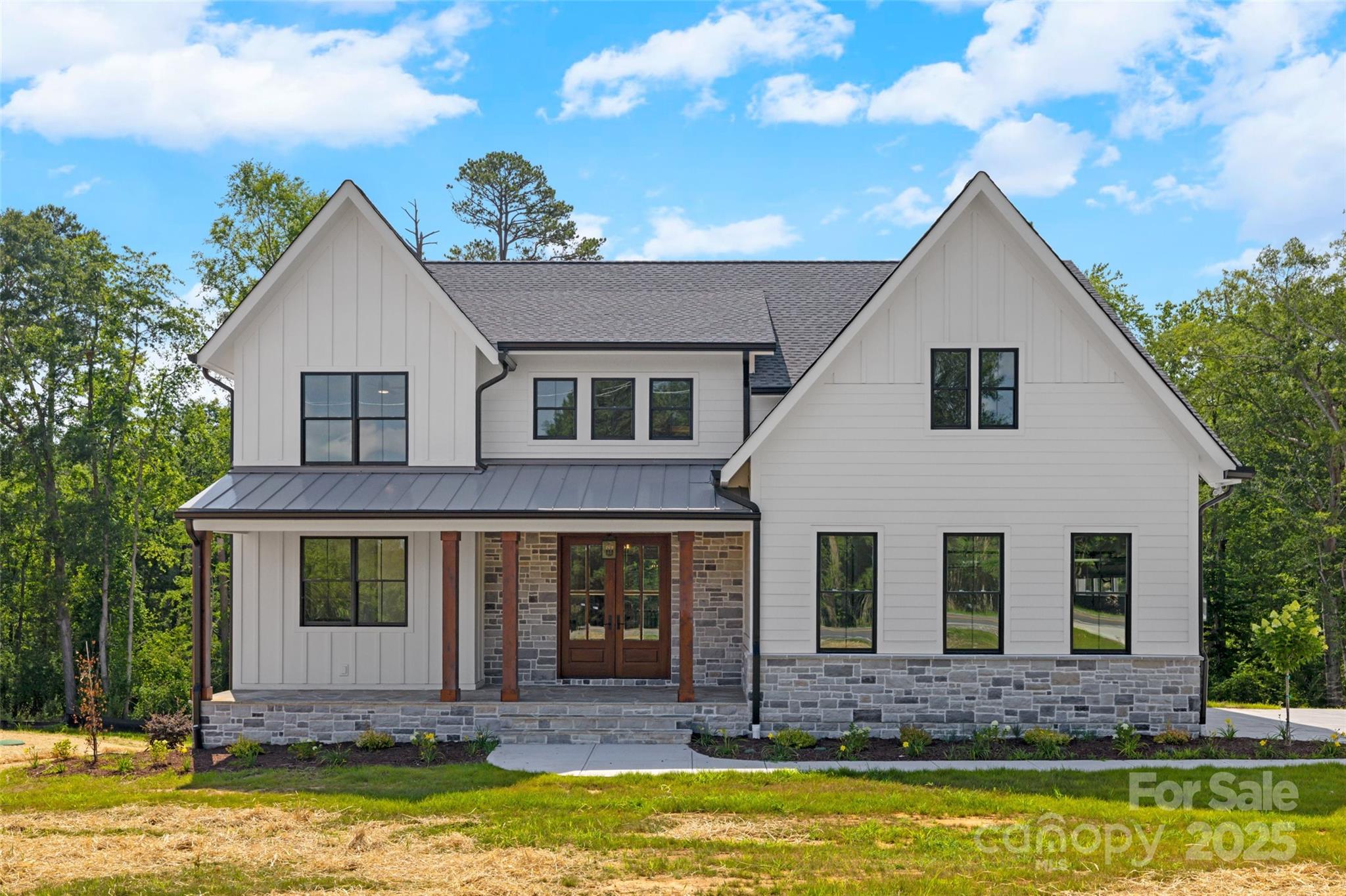 a view of a house with a swimming pool and next to a yard