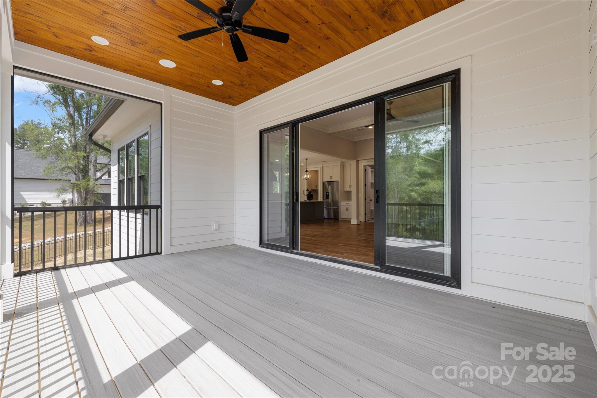 537 Riddle Mill Road Clover, SC 29710 - Photo 13 of 47 a view of a big room with wooden floor and windows