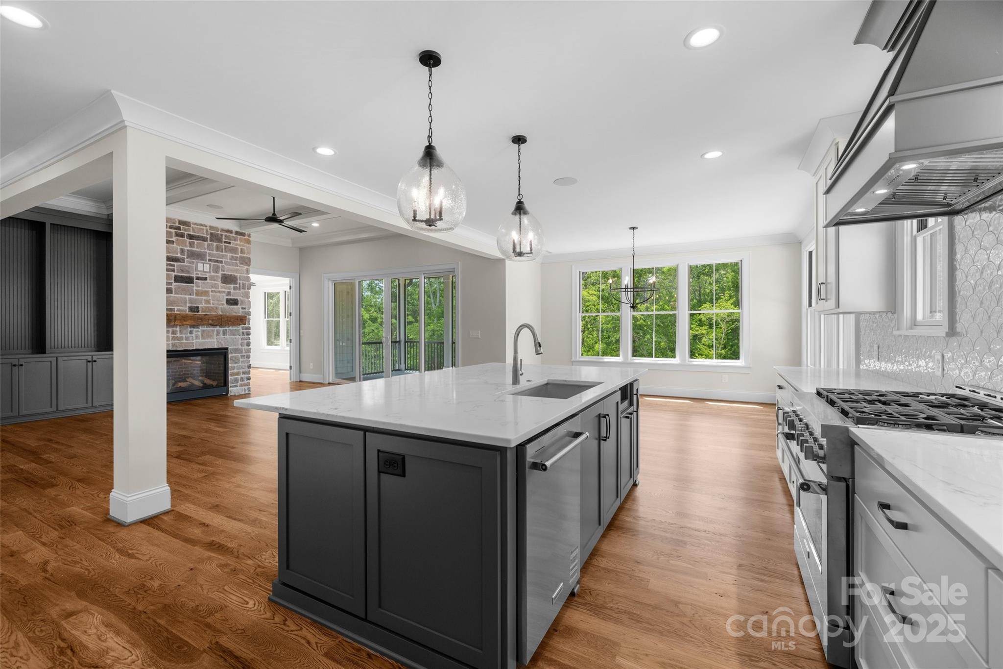 537 Riddle Mill Road Clover, SC 29710 - Photo 17 of 47 a kitchen with granite countertop a stove and a sink
