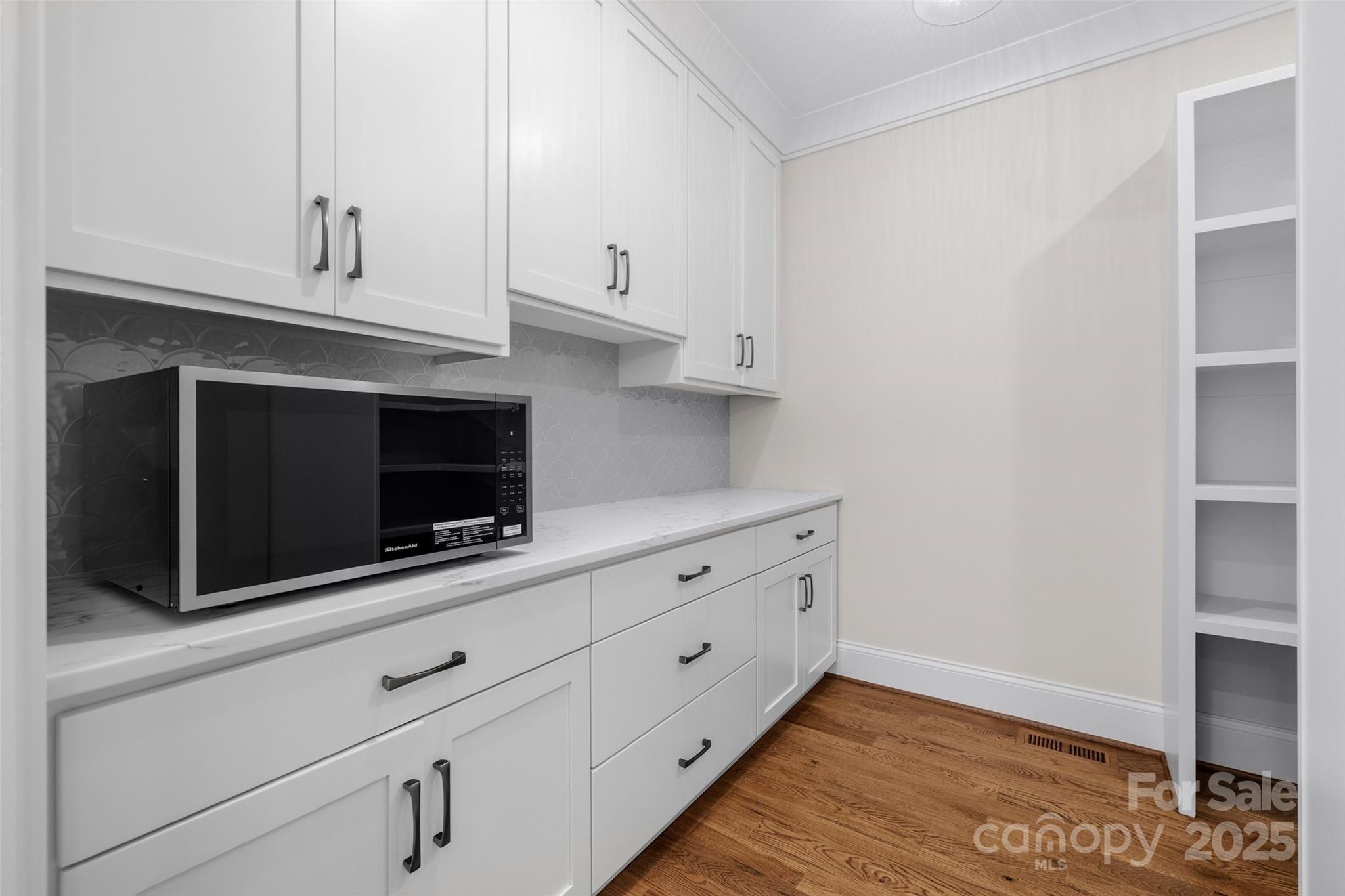 537 Riddle Mill Road Clover, SC 29710 - Photo 20 of 47 a kitchen with granite countertop white cabinets and oven