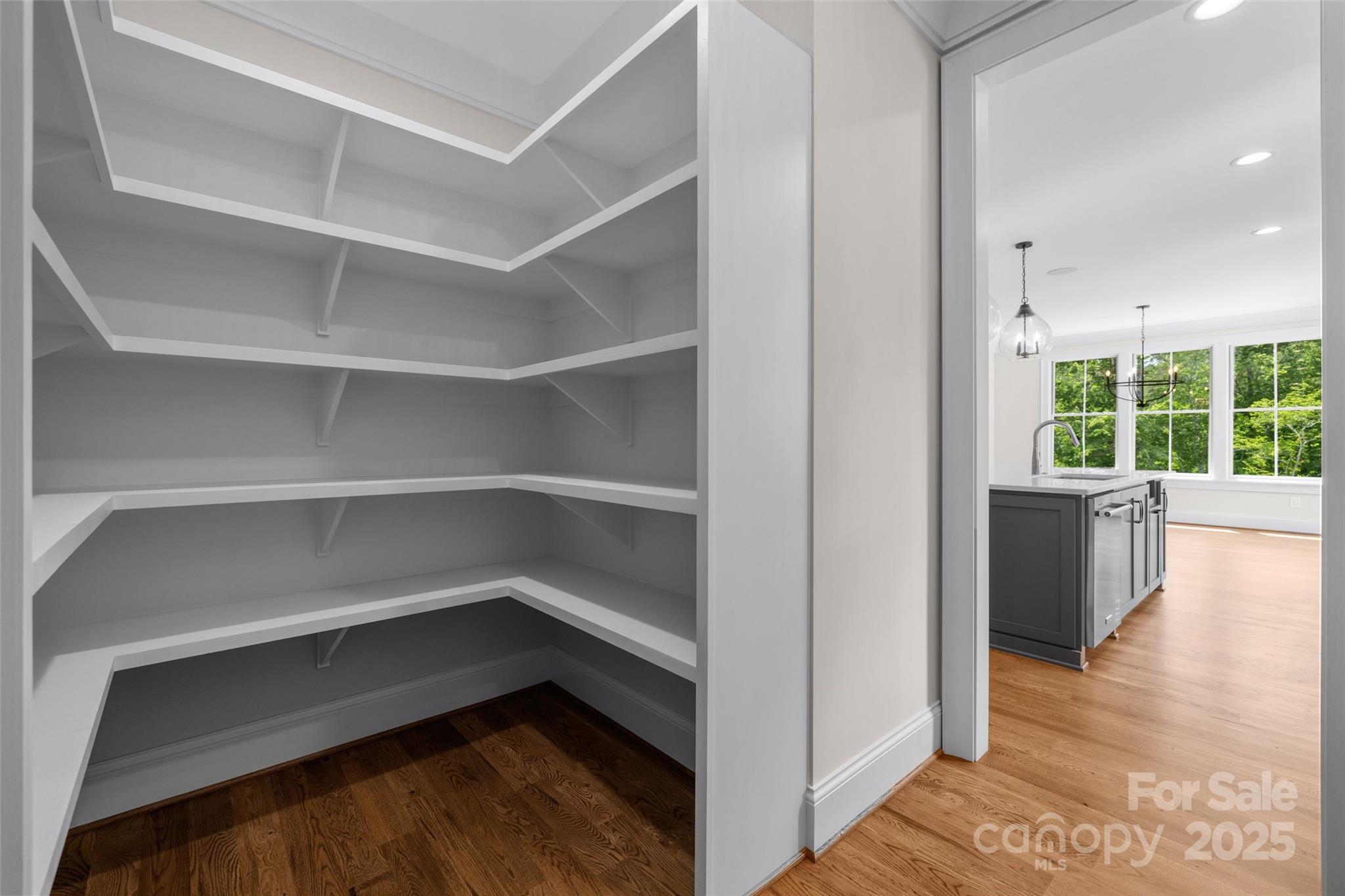 537 Riddle Mill Road Clover, SC 29710 - Photo 21 of 47 a storage room with wooden floor and windows