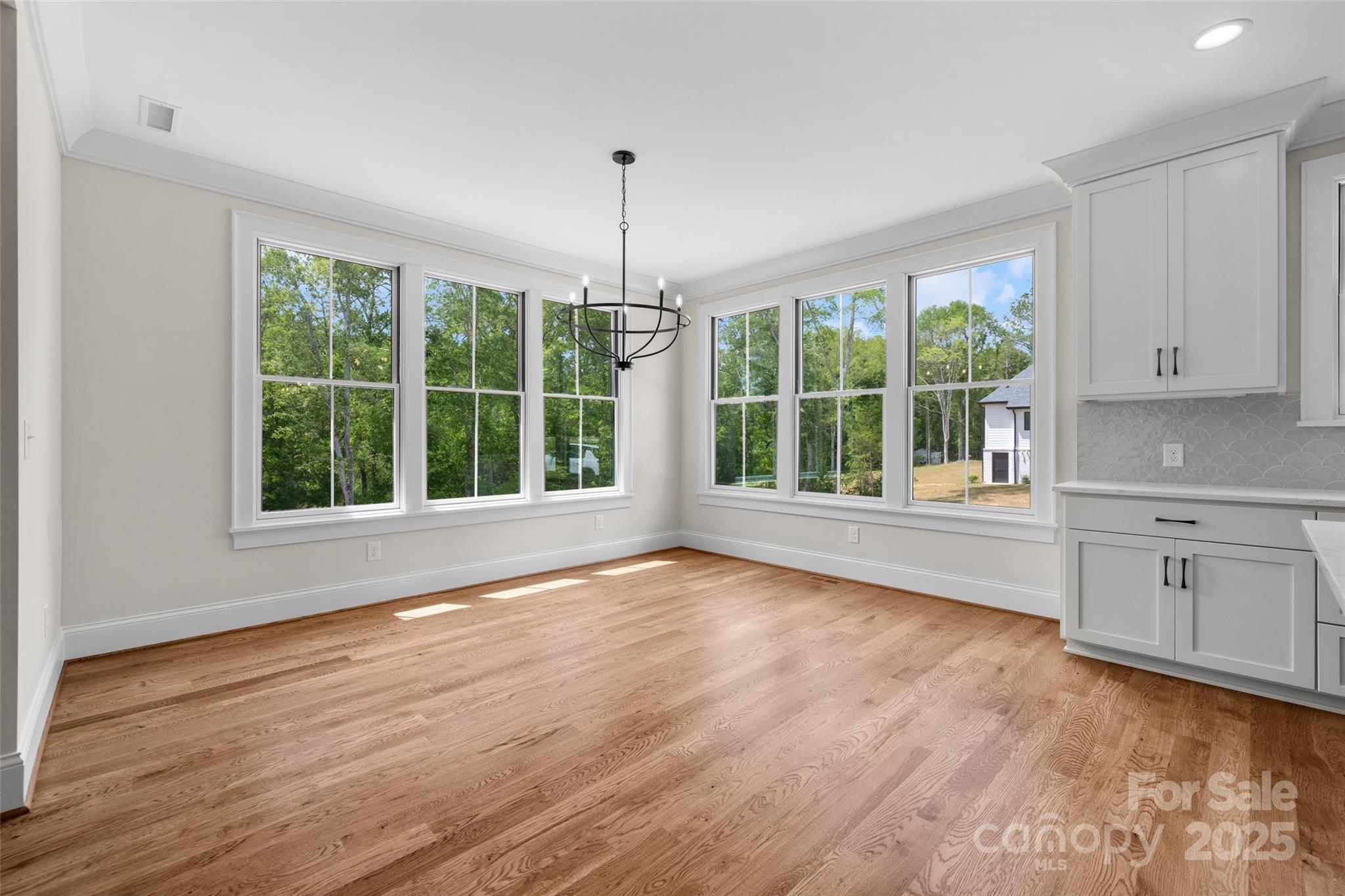 537 Riddle Mill Road Clover, SC 29710 - Photo 22 of 47 a view of an empty room with wooden floor and a window