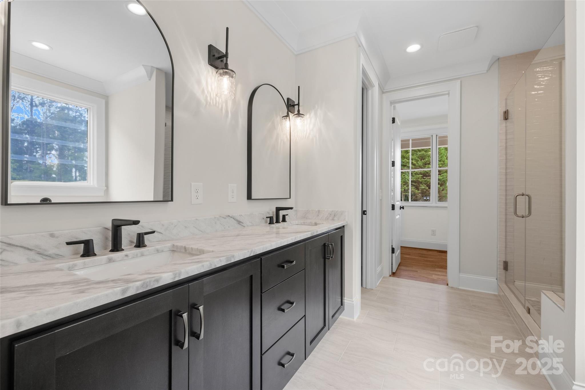 537 Riddle Mill Road Clover, SC 29710 - Photo 25 of 47 a bathroom with double sink and a mirror