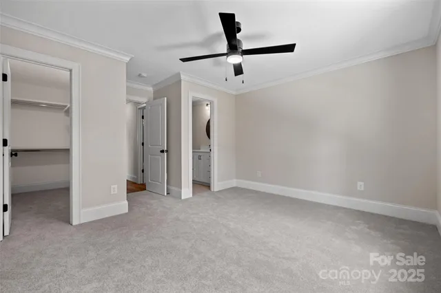 a view of empty room with ceiling fan