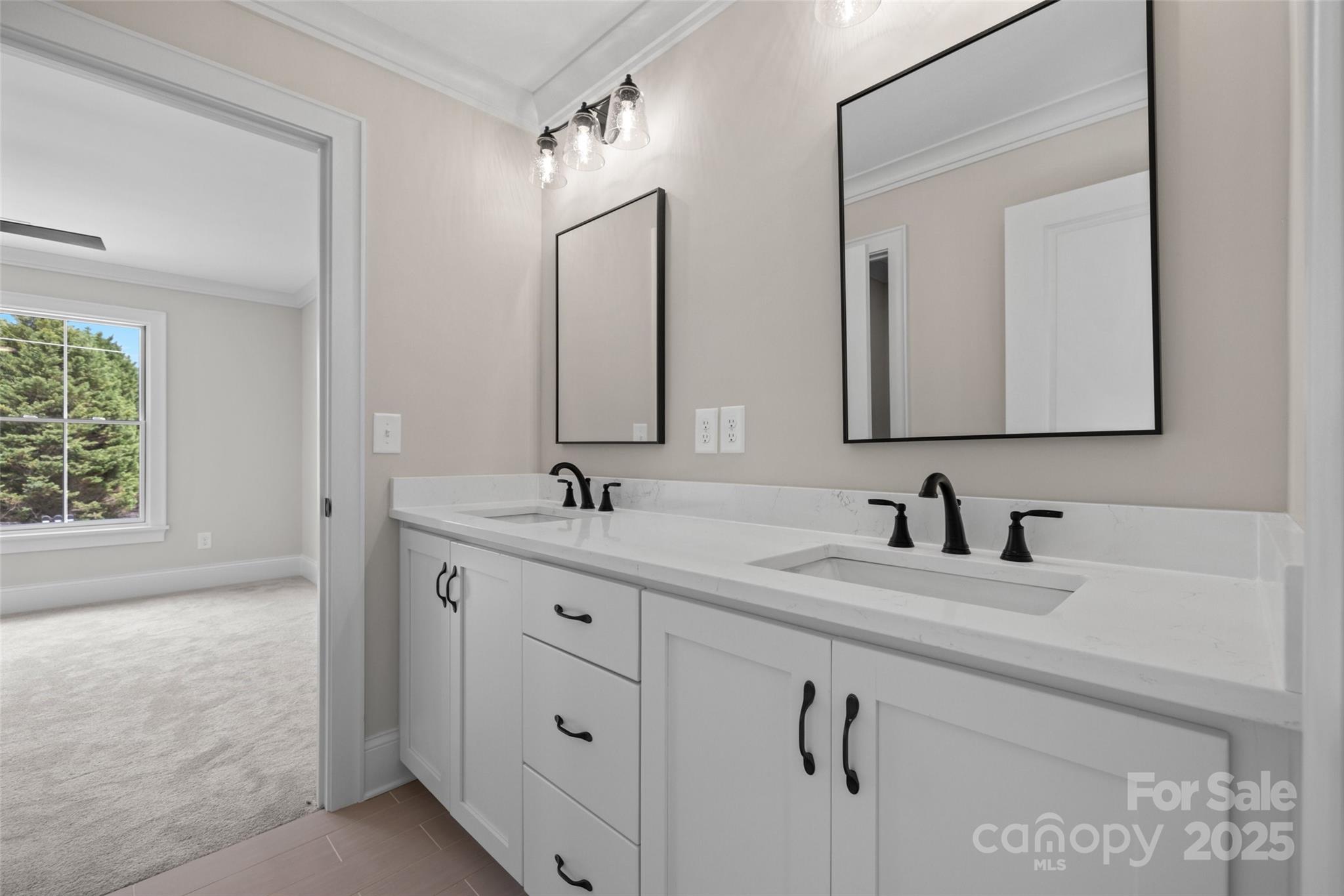 537 Riddle Mill Road Clover, SC 29710 - Photo 39 of 47 a bathroom with double sink and a mirror