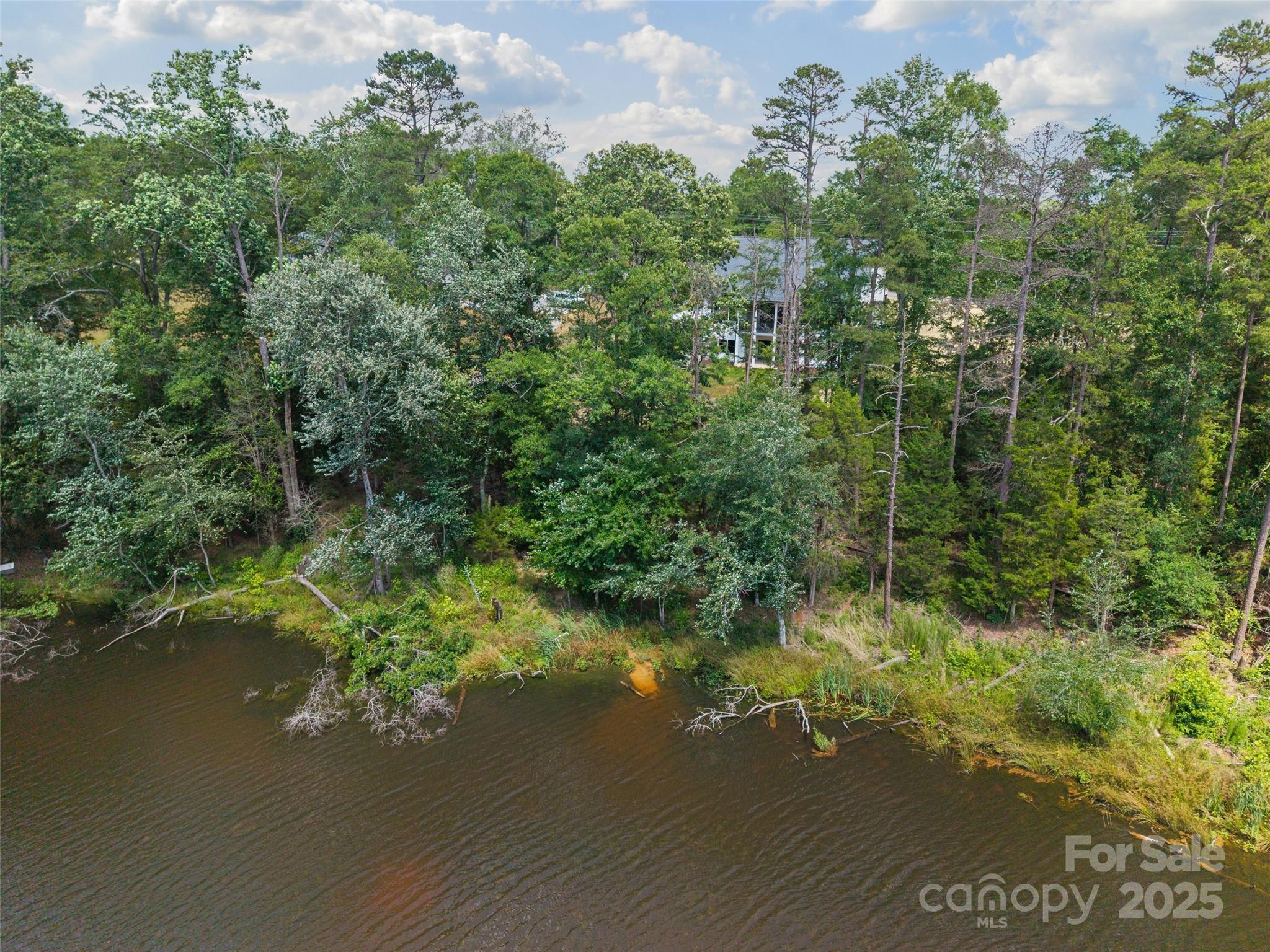 537 Riddle Mill Road Clover, SC 29710 - Photo 47 of 47 a view of a lake with a houses