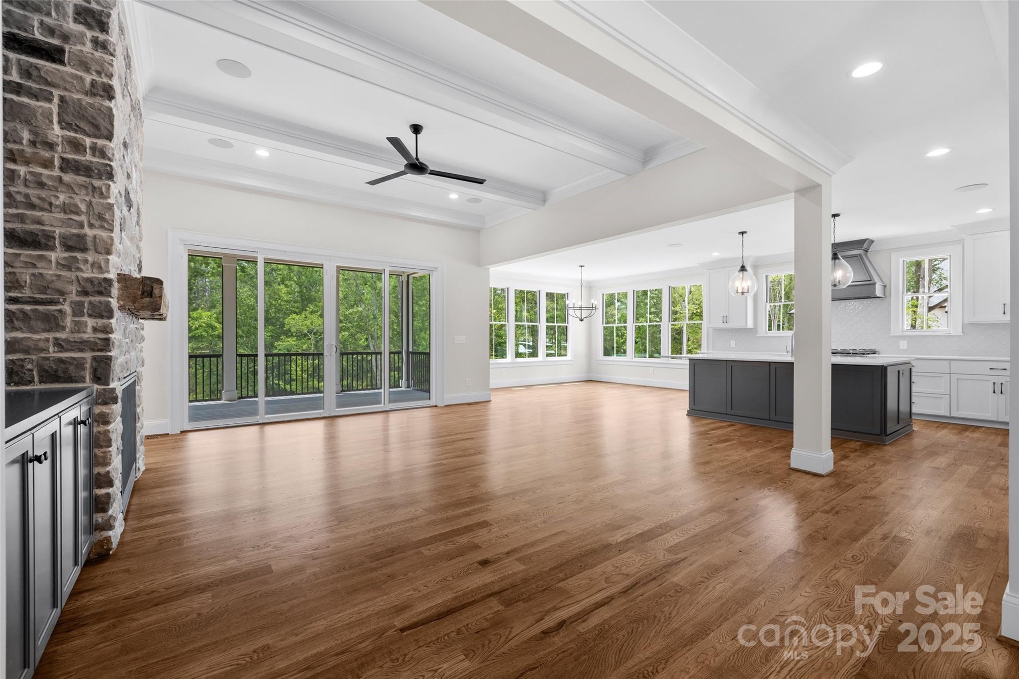 537 Riddle Mill Road Clover, SC 29710 - Photo 6 of 47 an empty room with wooden floor and windows