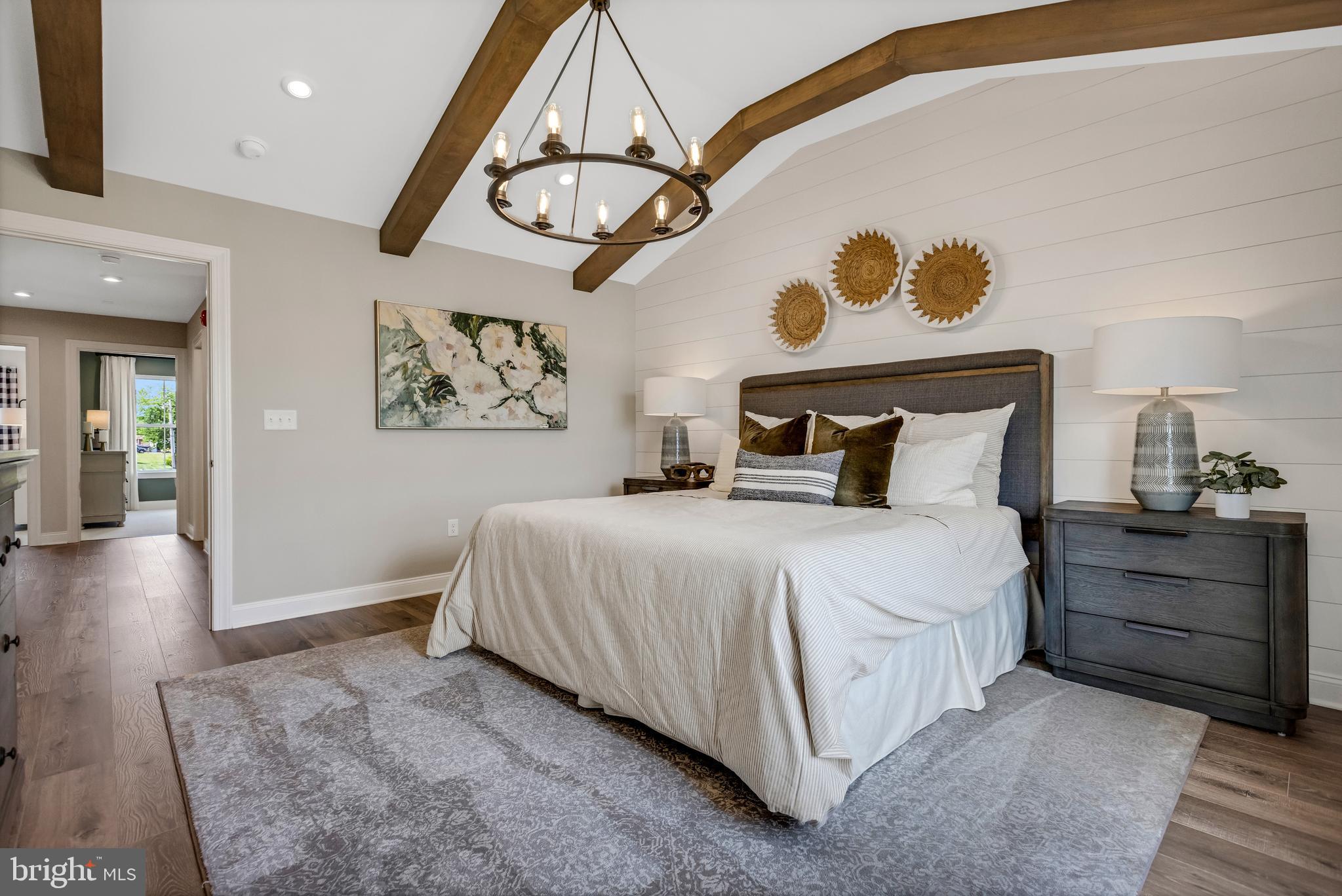 2 Baldwin Way Perkasie, PA 18944 - Photo 27 of 44 a bedroom with a bed and a chandelier