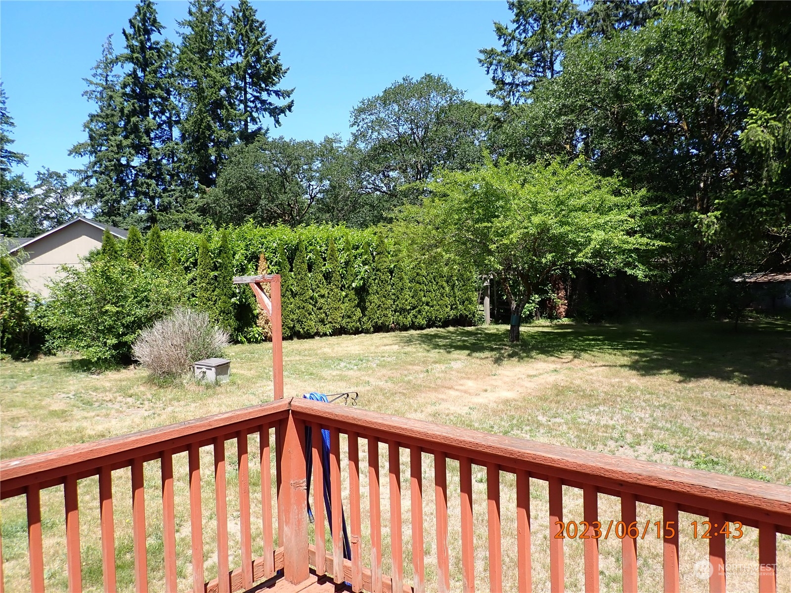 17940 Mi Lane Southwest Rochester, WA 98579 - Photo 14 of 39 a view of a yard with wooden fence