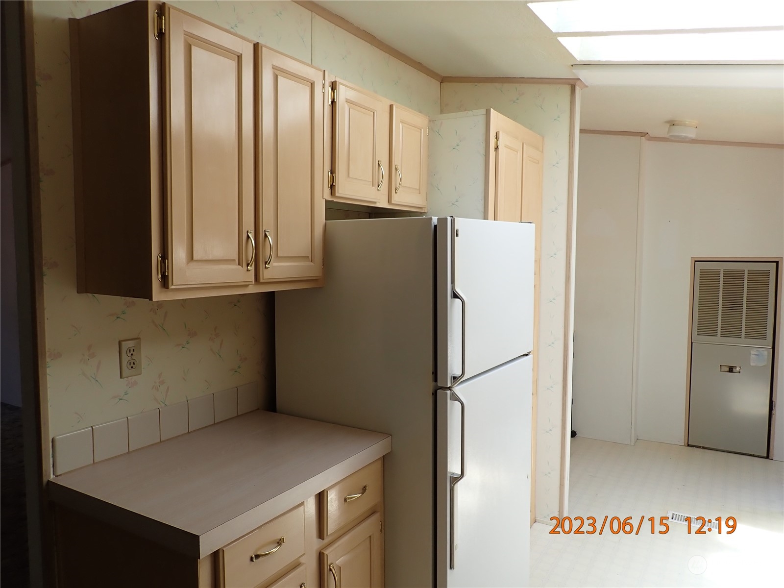 17940 Mi Lane Southwest Rochester, WA 98579 - Photo 22 of 39 a kitchen with a refrigerator and cabinets