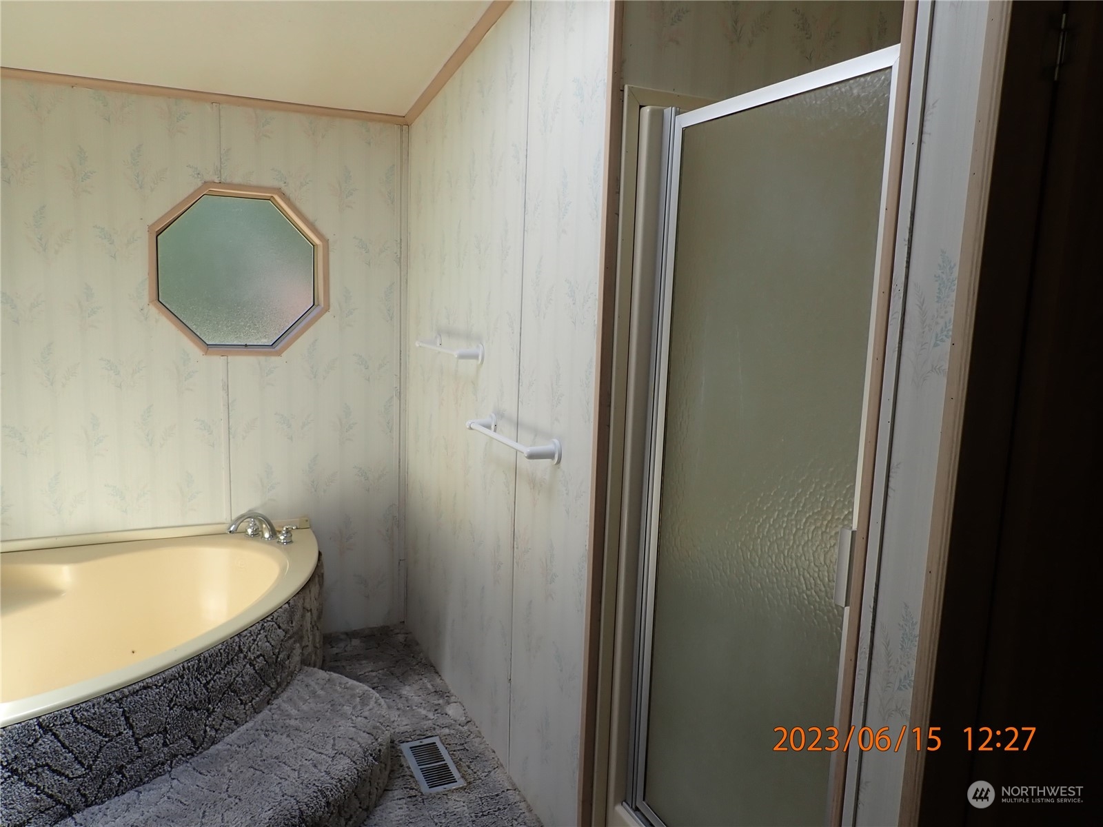 17940 Mi Lane Southwest Rochester, WA 98579 - Photo 30 of 39 a bathroom with a tub and a shower