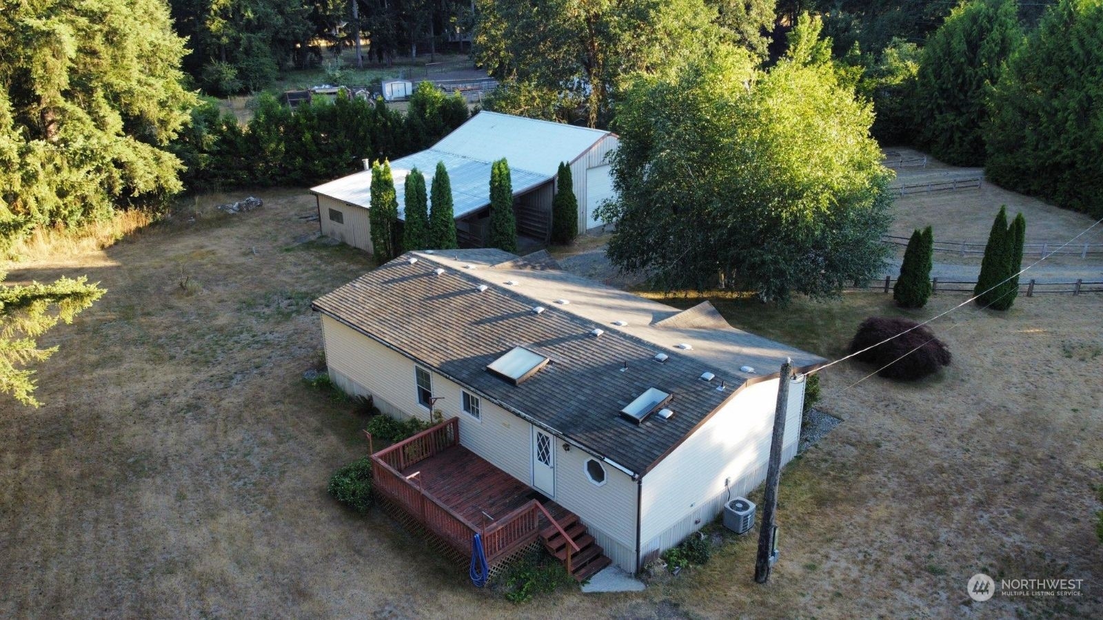 17940 Mi Lane Southwest Rochester, WA 98579 - Photo 7 of 39 an aerial view of a house with a yard and mountain