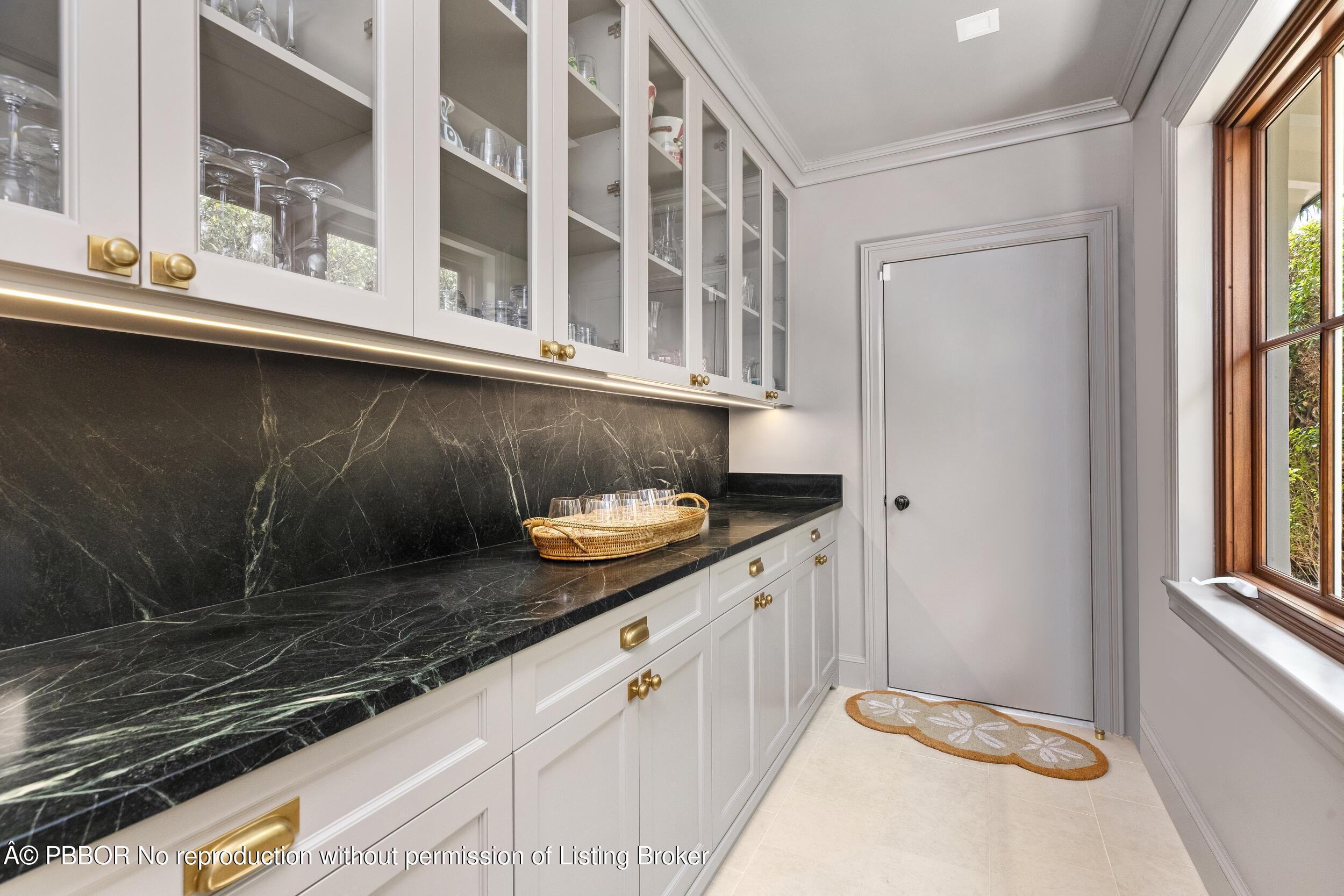 258 List Road Palm Beach, FL 33480 - Photo 18 of 45 a bathroom with a sink and a mirror