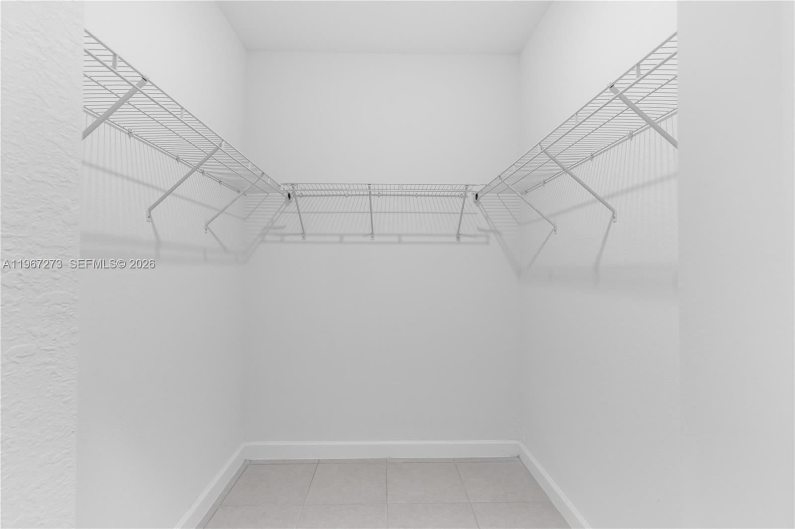 11947 Southwest 241 Terrace Homestead, FL 33032 - Photo 19 of 32 a view of a room with racks on the wall