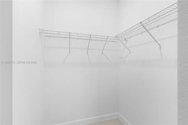 a bath tub sitting next to a white sink