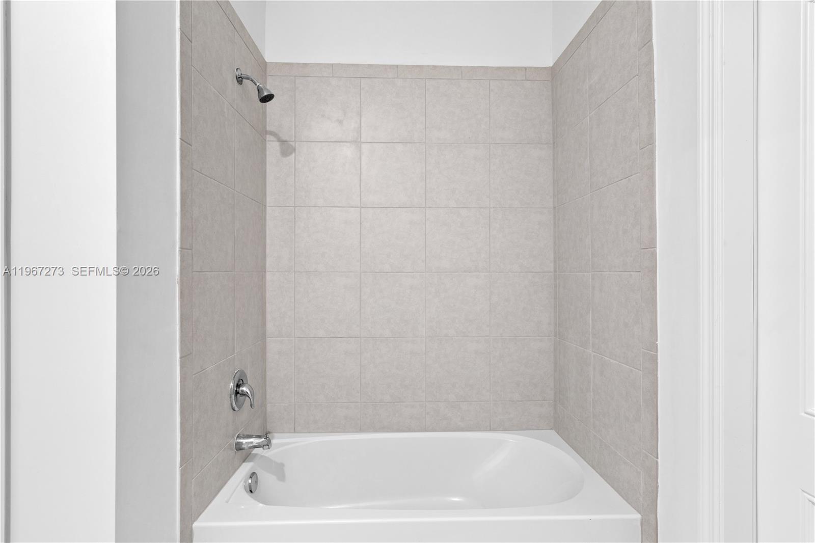 11947 Southwest 241 Terrace Homestead, FL 33032 - Photo 30 of 32 a bath tub sitting next to a white sink