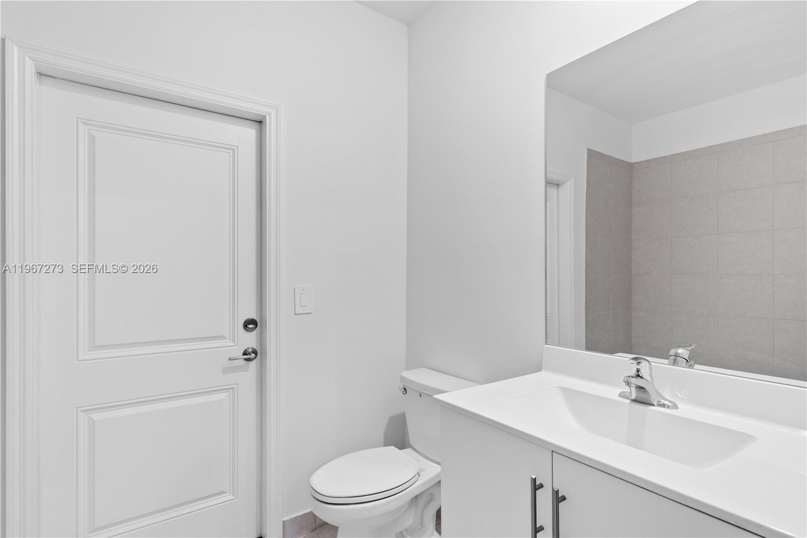 11947 Southwest 241 Terrace Homestead, FL 33032 - Photo 31 of 32 a bathroom with a sink a toilet and shower