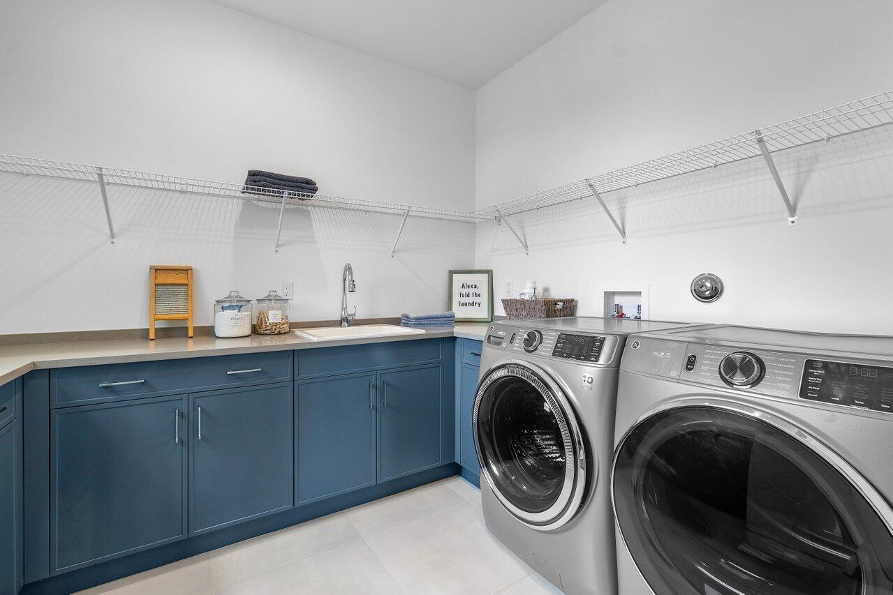 17128 Watersprite Lakes Road Boca Raton, FL 33496 - Photo 27 of 56 a utility room with sink dryer and washer
