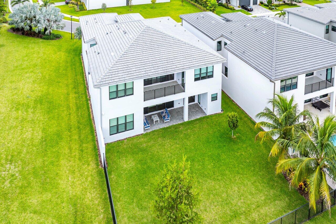 17128 Watersprite Lakes Road Boca Raton, FL 33496 - Photo 49 of 56 a view of house with backyard