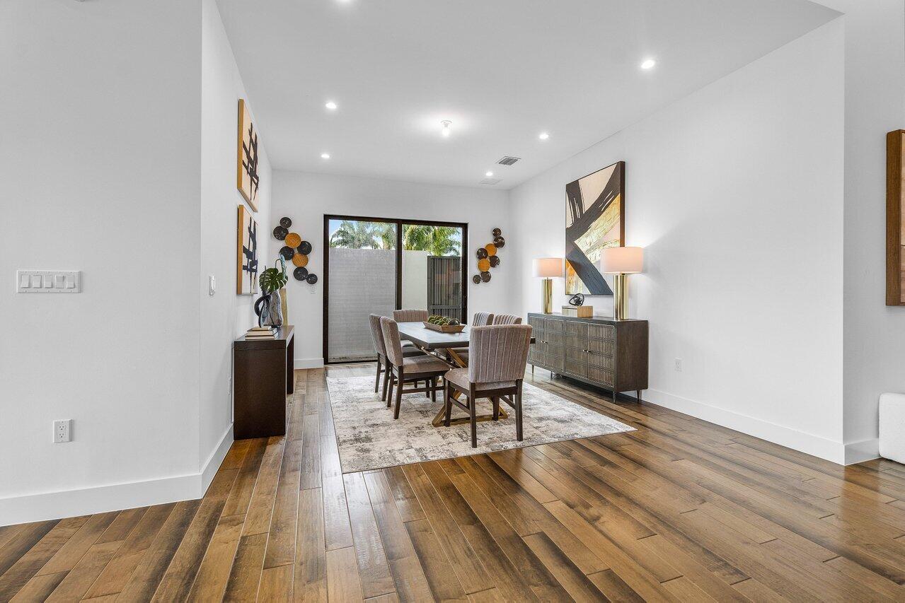 17128 Watersprite Lakes Road Boca Raton, FL 33496 - Photo 6 of 56 a living room with furniture and a wooden floor