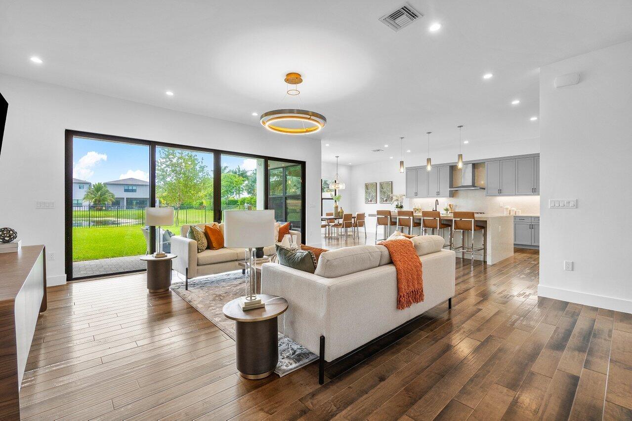 17128 Watersprite Lakes Road Boca Raton, FL 33496 - Photo 8 of 56 a living room with furniture and a large window