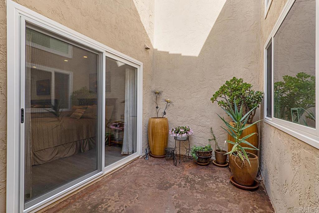 1237 Granada Way San Marcos, CA 92078 - Photo 16 of 27 a view of a balcony with potted plants