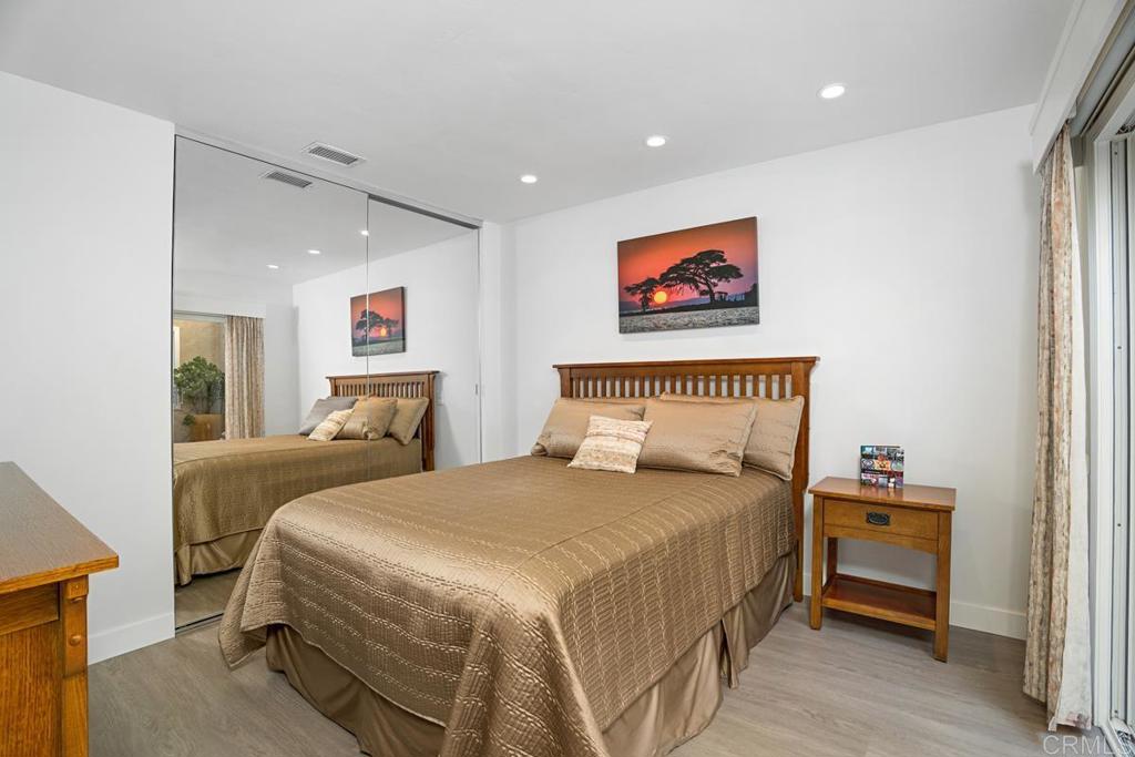 1237 Granada Way San Marcos, CA 92078 - Photo 19 of 27 a bedroom with a bed and a painting on the wall