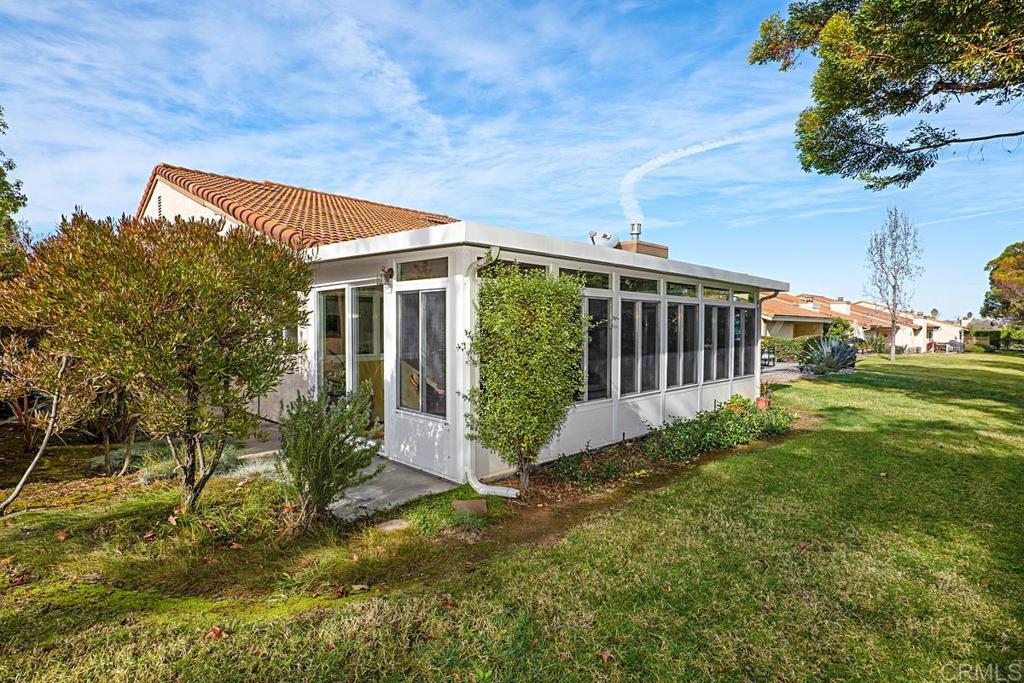 1237 Granada Way San Marcos, CA 92078 - Photo 25 of 27 a view of a house with backyard and garden
