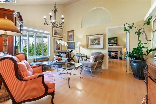 a living room with furniture chandelier and a chandelier
