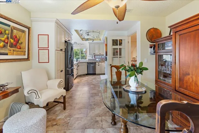 a bathroom with a granite countertop sink a toilet and shower